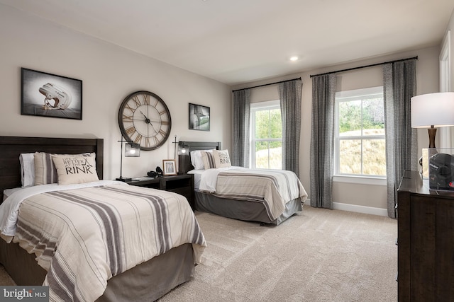 bedroom with recessed lighting, baseboards, and light colored carpet