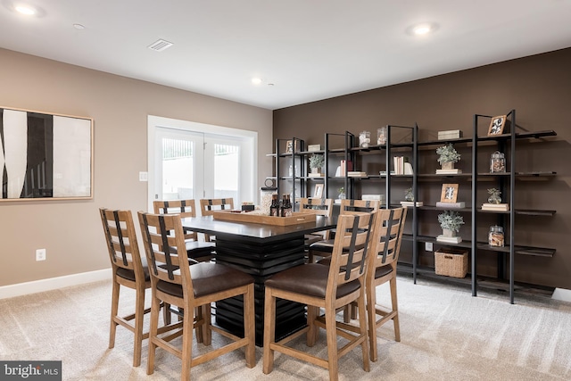 carpeted dining area featuring visible vents, recessed lighting, and baseboards