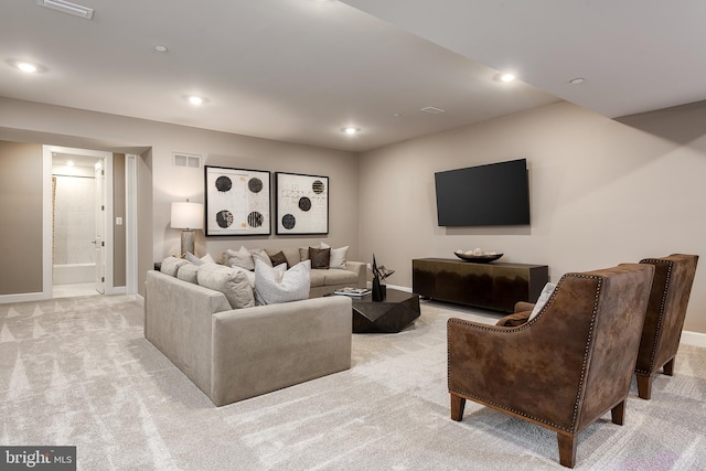 living area featuring recessed lighting, baseboards, light carpet, and visible vents