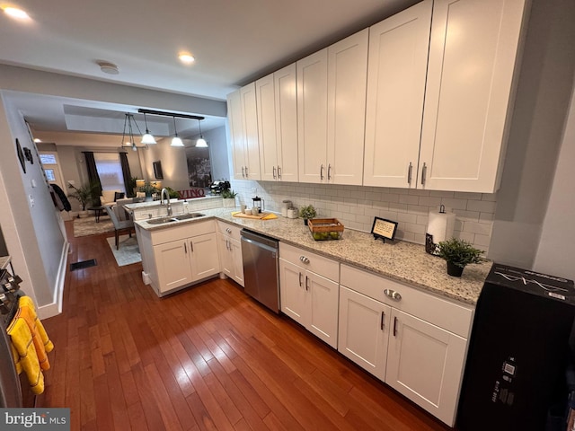 kitchen featuring a sink, dark wood-style flooring, white cabinetry, and stainless steel dishwasher