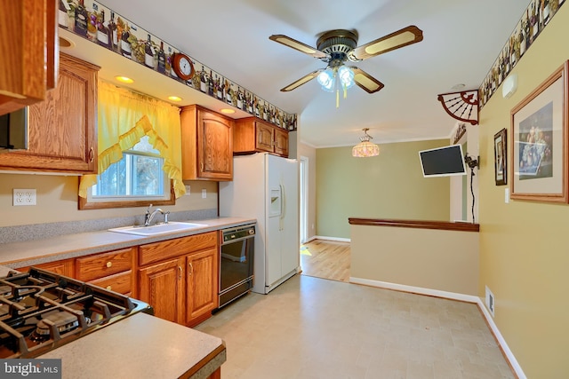 kitchen with a sink, black dishwasher, brown cabinetry, crown molding, and light countertops