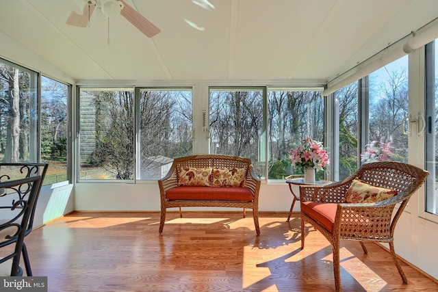 sunroom / solarium featuring ceiling fan