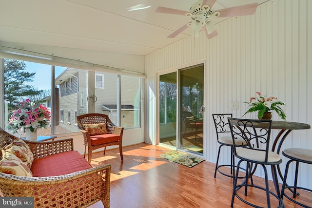 sunroom / solarium with ceiling fan