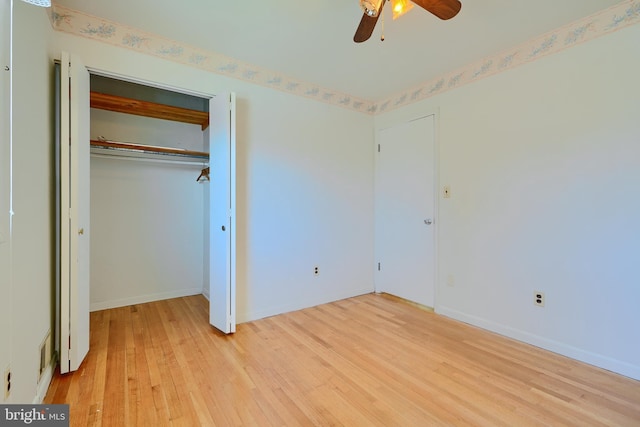 unfurnished bedroom with a closet, visible vents, light wood-type flooring, and baseboards