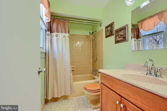 full bath with toilet, shower / tub combo with curtain, vanity, and tile patterned flooring