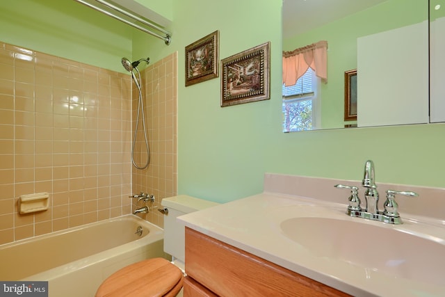 bathroom with toilet, vanity, and  shower combination