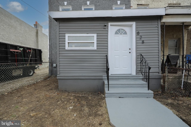 property entrance featuring fence