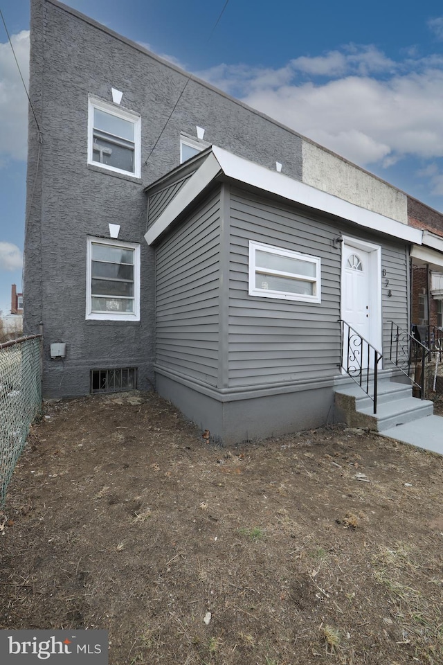 view of front of home with fence