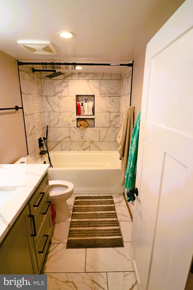 full bath featuring vanity, toilet, marble finish floor, and shower / bath combination