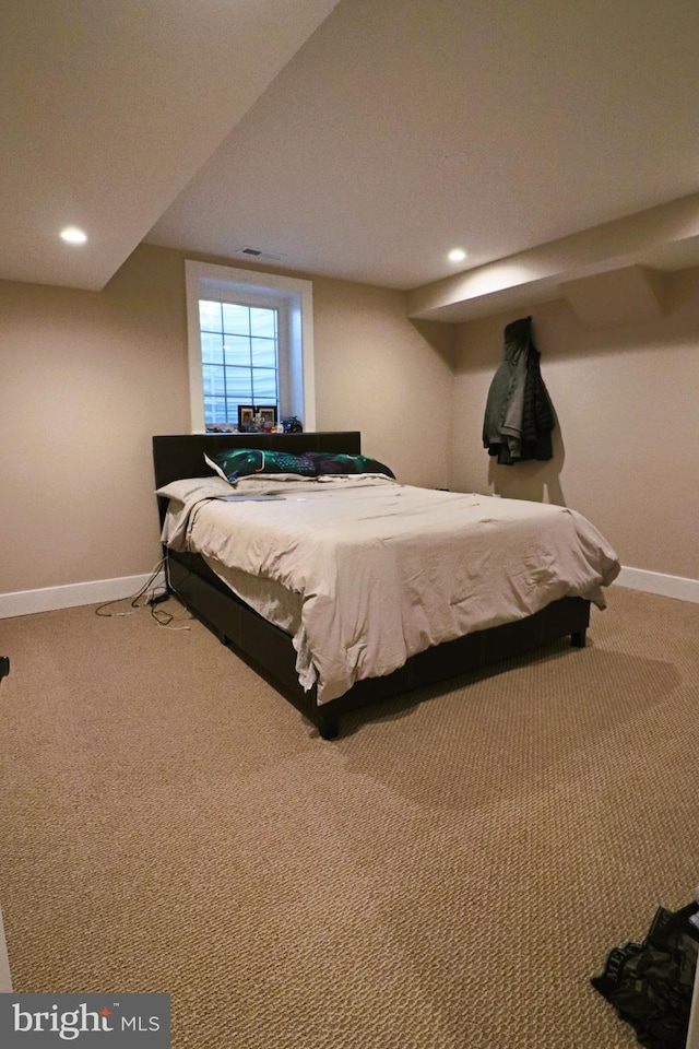 carpeted bedroom featuring recessed lighting and baseboards