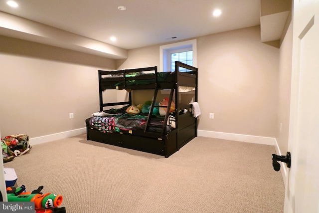 carpeted bedroom featuring recessed lighting, visible vents, and baseboards