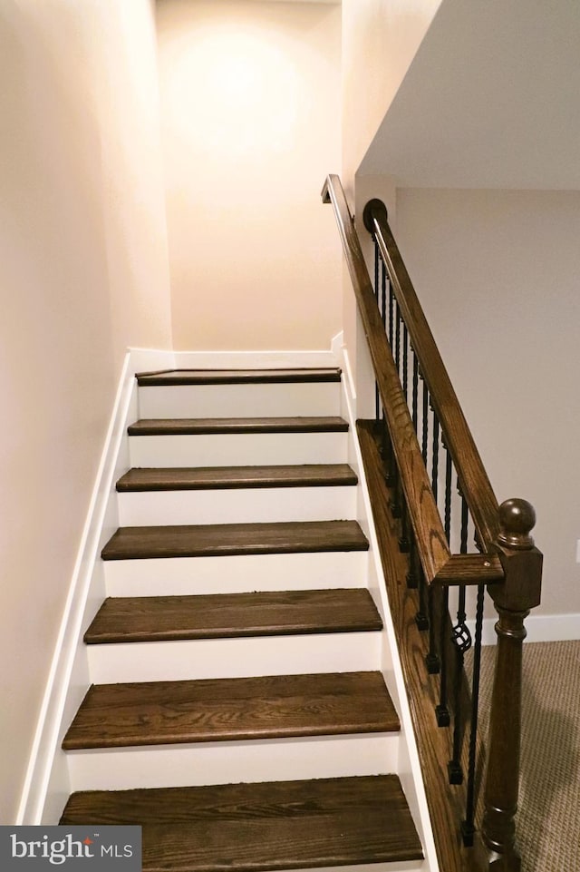 stairs featuring baseboards