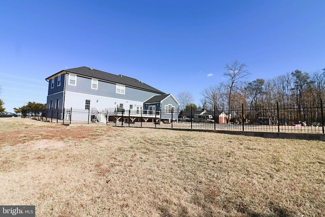 rear view of property with fence