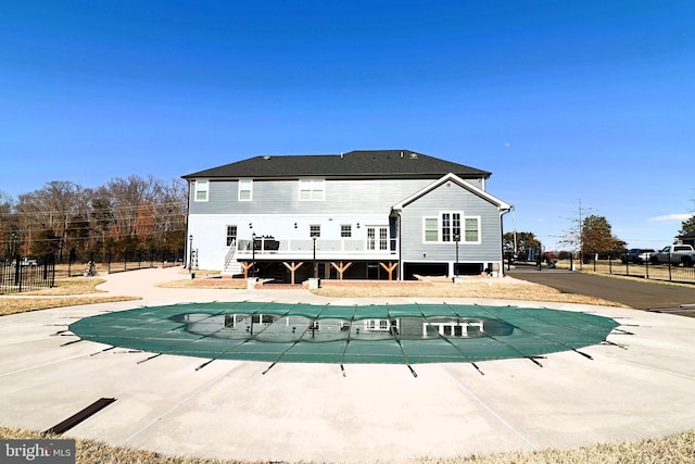 view of swimming pool with a fenced in pool, a deck, and fence