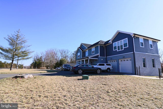 view of home's exterior with an attached garage and driveway