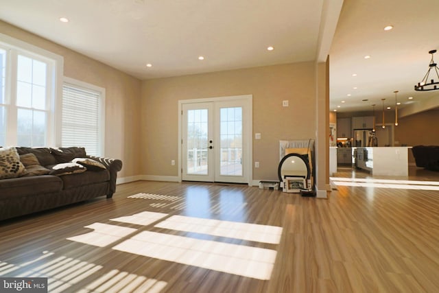 living area with recessed lighting and wood finished floors