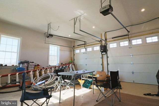 garage featuring recessed lighting and a garage door opener