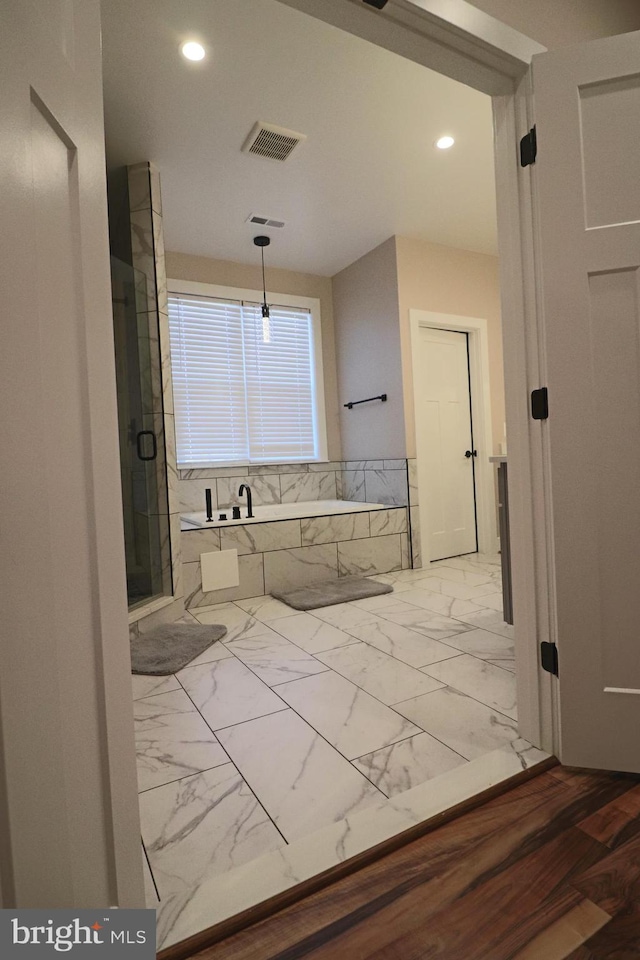 bathroom with a marble finish shower, visible vents, a garden tub, recessed lighting, and marble finish floor