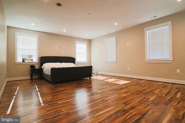 bedroom featuring recessed lighting, visible vents, baseboards, and wood finished floors