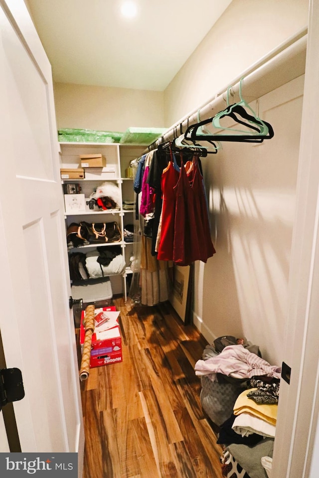 spacious closet with wood finished floors