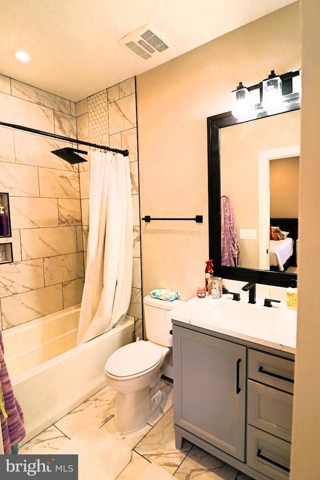 full bathroom with visible vents, toilet, shower / bath combo with shower curtain, marble finish floor, and vanity