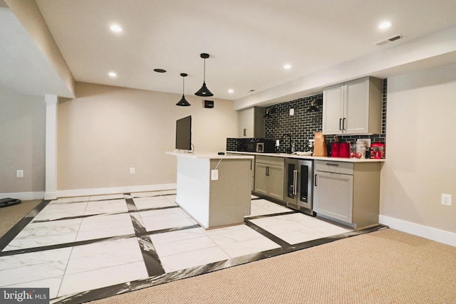 kitchen featuring marble finish floor, recessed lighting, wine cooler, decorative backsplash, and baseboards