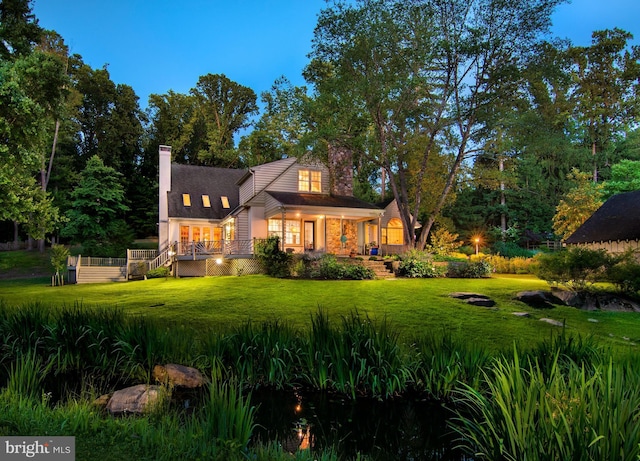 view of front of property with a front lawn and a chimney