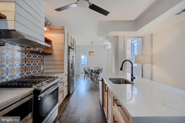 kitchen featuring range hood, visible vents, dark wood finished floors, a sink, and stainless steel appliances