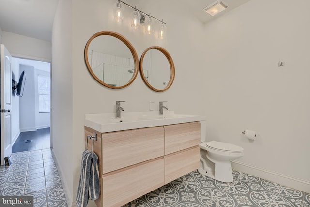 bathroom featuring visible vents, toilet, tile patterned flooring, double vanity, and baseboards