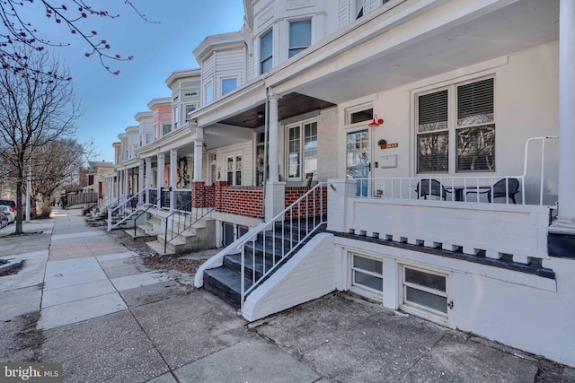 property entrance with a residential view and a porch