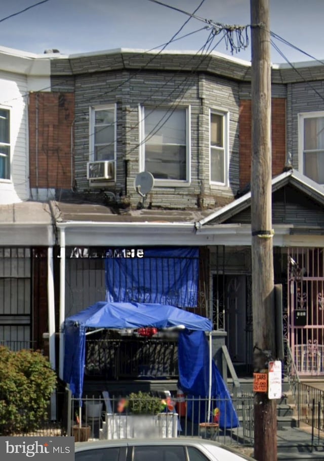 back of house featuring cooling unit