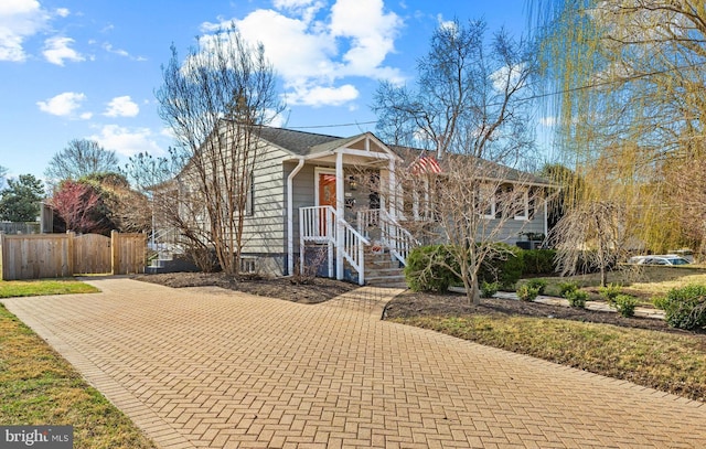 view of front of house with fence