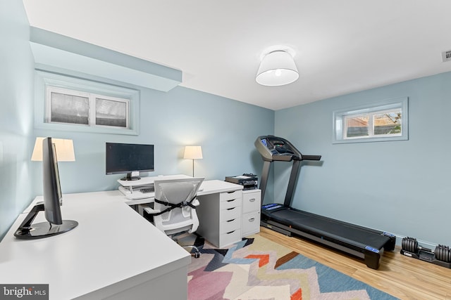 office featuring visible vents and light wood-style flooring