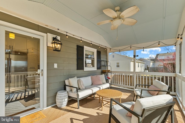 wooden terrace featuring a ceiling fan and outdoor lounge area