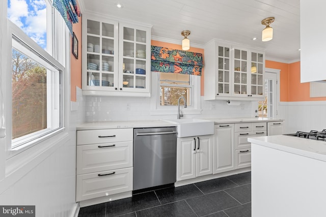 kitchen with glass insert cabinets, crown molding, dishwasher, white cabinetry, and a sink