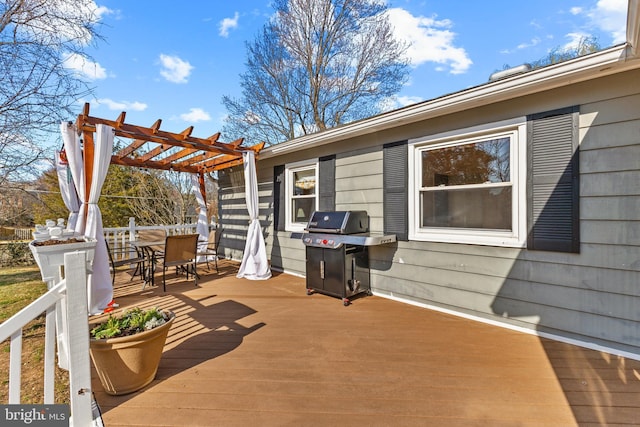 wooden deck featuring outdoor dining space, a grill, and a pergola