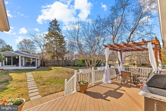 deck with outdoor dining space, a yard, a fenced backyard, and a pergola