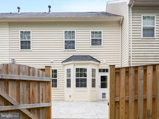 325 Quinton Oaks Cir, Stephens City, VA 22655 - rear view of house with a patio and roof with shingles