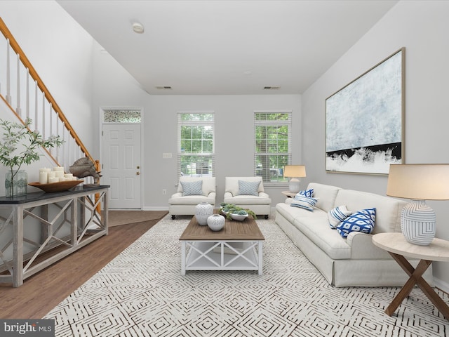 325 Quinton Oaks Cir, Stephens City, VA 22655 - living room featuring stairway and wood finished floors