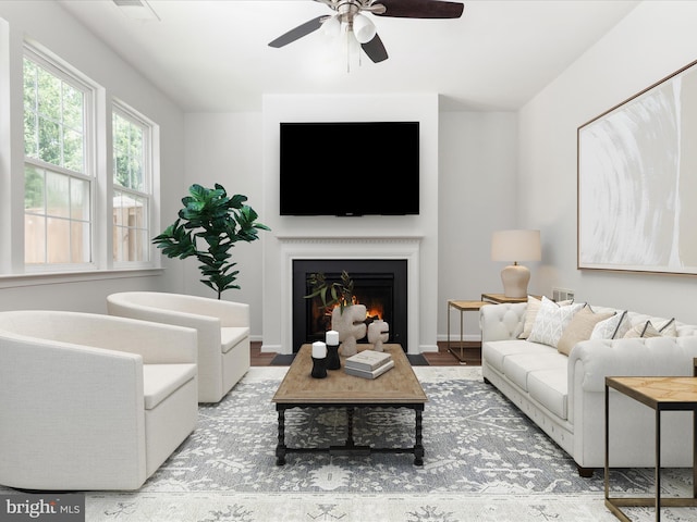 325 Quinton Oaks Cir, Stephens City, VA 22655 - living area featuring ceiling fan, a fireplace with flush hearth, and wood finished floors