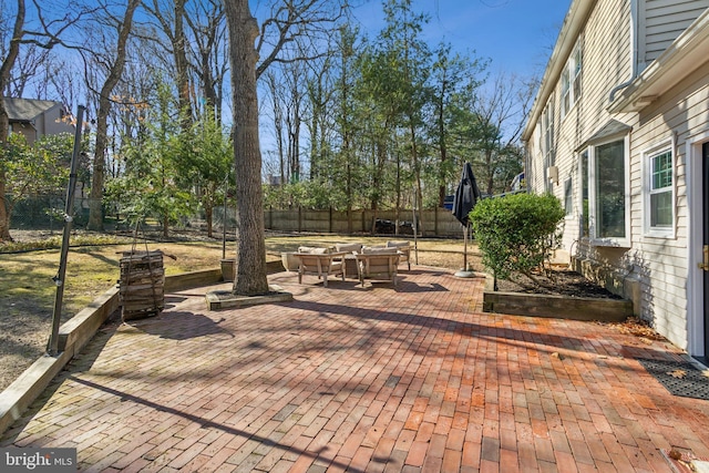 view of patio featuring fence