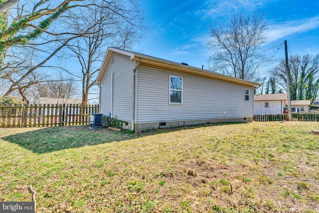 back of house featuring a yard, fence, central AC, and crawl space