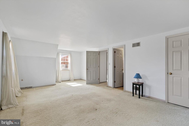 unfurnished bedroom featuring visible vents, baseboards, and carpet