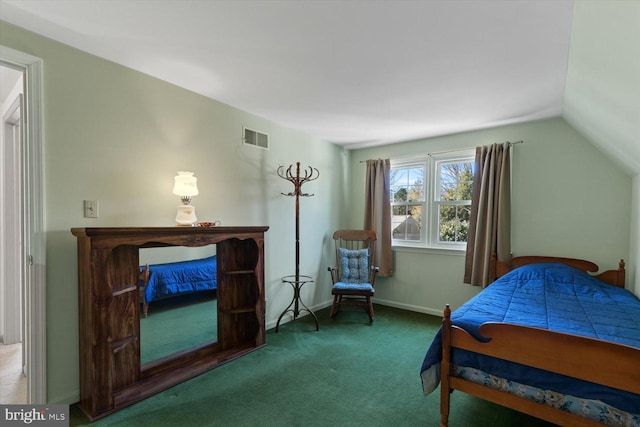 bedroom with visible vents, lofted ceiling, baseboards, and carpet flooring