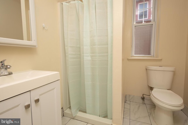 full bath with toilet, marble finish floor, a stall shower, and vanity