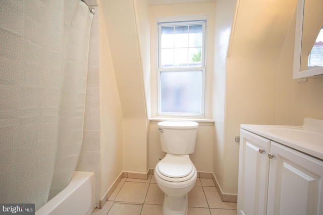 bathroom featuring tile patterned flooring, baseboards, toilet, vanity, and shower / bathtub combination with curtain