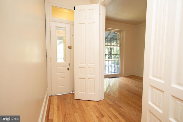 interior space with visible vents, baseboards, and light wood-style flooring