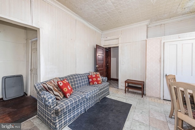 living area with an ornate ceiling and crown molding