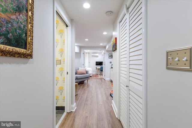 hall with recessed lighting, baseboards, and wood finished floors