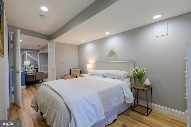 bedroom featuring recessed lighting, baseboards, and light wood-style flooring